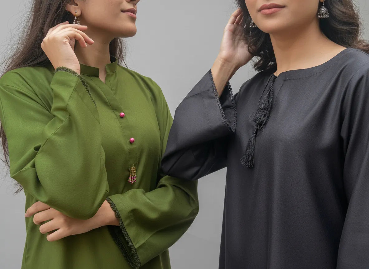Two women wearing green and black traditional outfits against a gray background